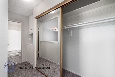 a mirror in a bathroom with a closet